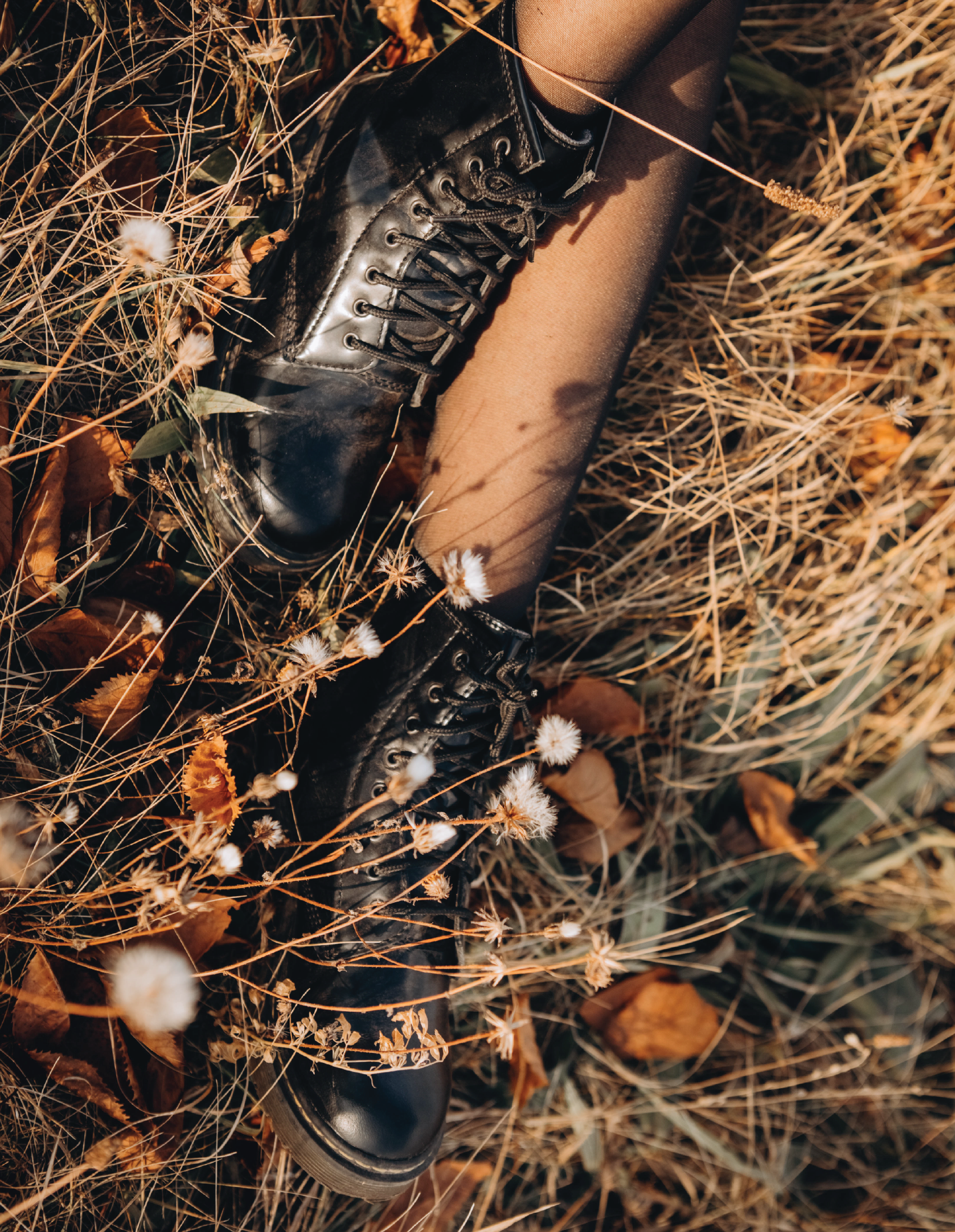 partial image of woman in a field with Shoes representing fall and winter season